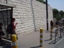 The bus stop and the two memorial plates on the wall