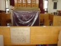 The memorial plaque inmemory of the four, the table cloth is in memory of Erez Shmuel also killed in Hebron