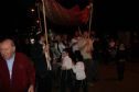 Gideon's father carries the Torah to the Synagogue